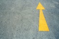 Arrow on the road and yellow colour photo Royalty Free Stock Photo