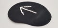 An arrow sign on black computer mouse pad Royalty Free Stock Photo