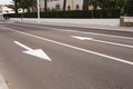 Arrow signs as road markings on a street with two lanes Royalty Free Stock Photo