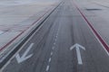 Arrow signs on the road.  taxiway for airplanes and tracks for road transport. Airport. Travel concept Royalty Free Stock Photo