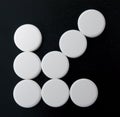 Arrow of white tablets