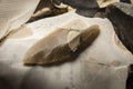 An arrowhead made from flintstone close up