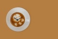 Arrows of clock on the a cup of coffee surface Royalty Free Stock Photo