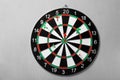 Arrows hitting dart board on grey  wall Royalty Free Stock Photo