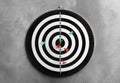 Arrows hitting dart board on grey Royalty Free Stock Photo