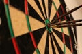 Arrows hitting dartboard - close-up