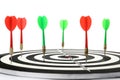 Arrows hitting target on dart board against background Royalty Free Stock Photo