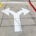 Arrows and lines on the asphalt to indicate the direction of driving Royalty Free Stock Photo