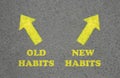 Arrows with two opposite directions to Old and New Habits on asphalt, top view Royalty Free Stock Photo