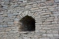 Arrowslit in the ancient wall Royalty Free Stock Photo