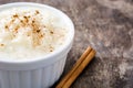 Arroz con leche. Rice pudding with cinnamon on wood Royalty Free Stock Photo