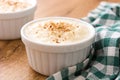 Arroz con leche. Rice pudding with cinnamon on wood