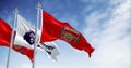 Arsenal Football Club and Premier League flags waving on a clear day