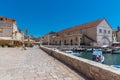 Arsenal in Hvar with cathedral of Saint Stephan in background, Croatia