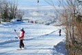 Arsenyev, Russia, January, 28, 2017. Snowboarder rises to the rope tow to the top of the ski slope in the city of Arsenyev, Primor