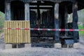Arson crime scene of a burnt hut cordoned off with german police barrier tape