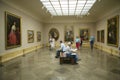Art appreciators view paintings in Museum de Prado, Prado Museum, Madrid, Spain Royalty Free Stock Photo