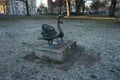 Statue of a pair of swans in a park in winter. 12555 Berlin, Germany