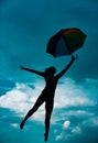 Art ballet. Silhouette of yoga woman with umbrella stretching with pose stretch. Fit fitness athlete girl exercising Royalty Free Stock Photo