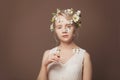 Art beauty portrait of young woman with white butterflies and flowers on her skin and her hair Royalty Free Stock Photo