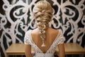 Art of braiding Hairdressers rear view as intricate braid transforms wedding hair styling Royalty Free Stock Photo