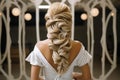 Art of braiding Hairdressers rear view as intricate braid transforms wedding hair styling Royalty Free Stock Photo