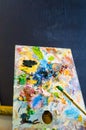 Art brush and palette with oil paints