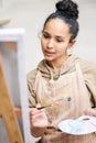 Art, canvas and thinking with painter woman in studio for creative, expression or leisure hobby. Inspiration, paintbrush Royalty Free Stock Photo