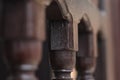 The art of carving wood fence details with macro and blur look and dark brown wood color Royalty Free Stock Photo