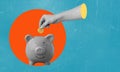 Art collage, the hand puts cryptocurrency in a piggy bank on blue background with space for text