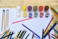 Art concept. Many colored pencils, brushes and jars of paint on Royalty Free Stock Photo
