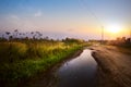 Art countryside Landscap; road in the farmland field after rain