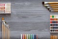 Art creative table background with supplies tools on grey wooden desk