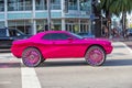 art deco district at ocean drive in Miami beach with a pink pimped car and big chrome wheels Royalty Free Stock Photo