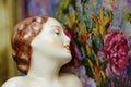 Art deco flapper girl antique statue with flowers