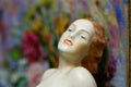 Art deco flapper girl antique statue with flowers