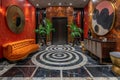 Art Deco-inspired entryway with bold geometric patterns and metallic finishes