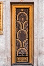 Art deco style European door with gold colored fish scale ornaments