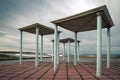 Art deco style pergolas located on a promenade next to the beach