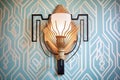 an art deco wall sconce casting patterned shadows Royalty Free Stock Photo