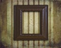 Art deco wooden frame on grunge and faded wallpaper