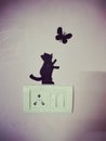 SwitchBoard Painting of a Cute Cat Catching a Butterfly Royalty Free Stock Photo