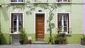 Art drawings on facade of beautiful green house, Rue Cremieux street in Paris