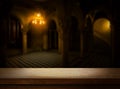 Art Empty wooden table on mystical dungeon of an ancient gothic castle background. Mock-up in the style of a men`s party, for the Royalty Free Stock Photo