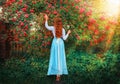 Art Fantasy young woman in vintage old style clothing white blouse, blue skirt back rear view, girl long curly red hair Royalty Free Stock Photo