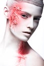 Art fashion girl with white skin and red paint on