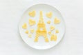 Art food concept. Eiffel Tower with silhouette of a couple in love and heart shaped balls Royalty Free Stock Photo