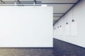 Art gallery with a blank wall and row of pictures, toned Royalty Free Stock Photo