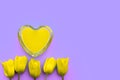 Art heart and yellow tulips on a lilac background, creative fragile love background, valentines day concept Royalty Free Stock Photo