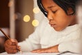 Art is her favourite subject. a little girl drawing at home. Royalty Free Stock Photo